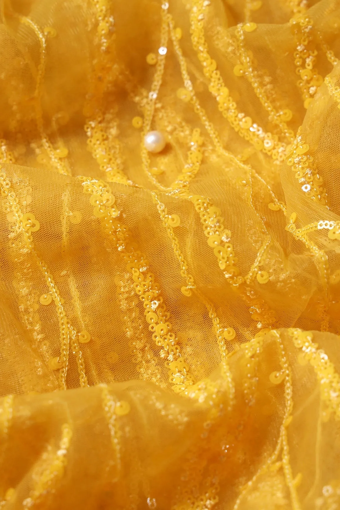 Beautiful Sequins With Yellow Thread Wavy Embroidery Work On Yellow Soft Net Fabric